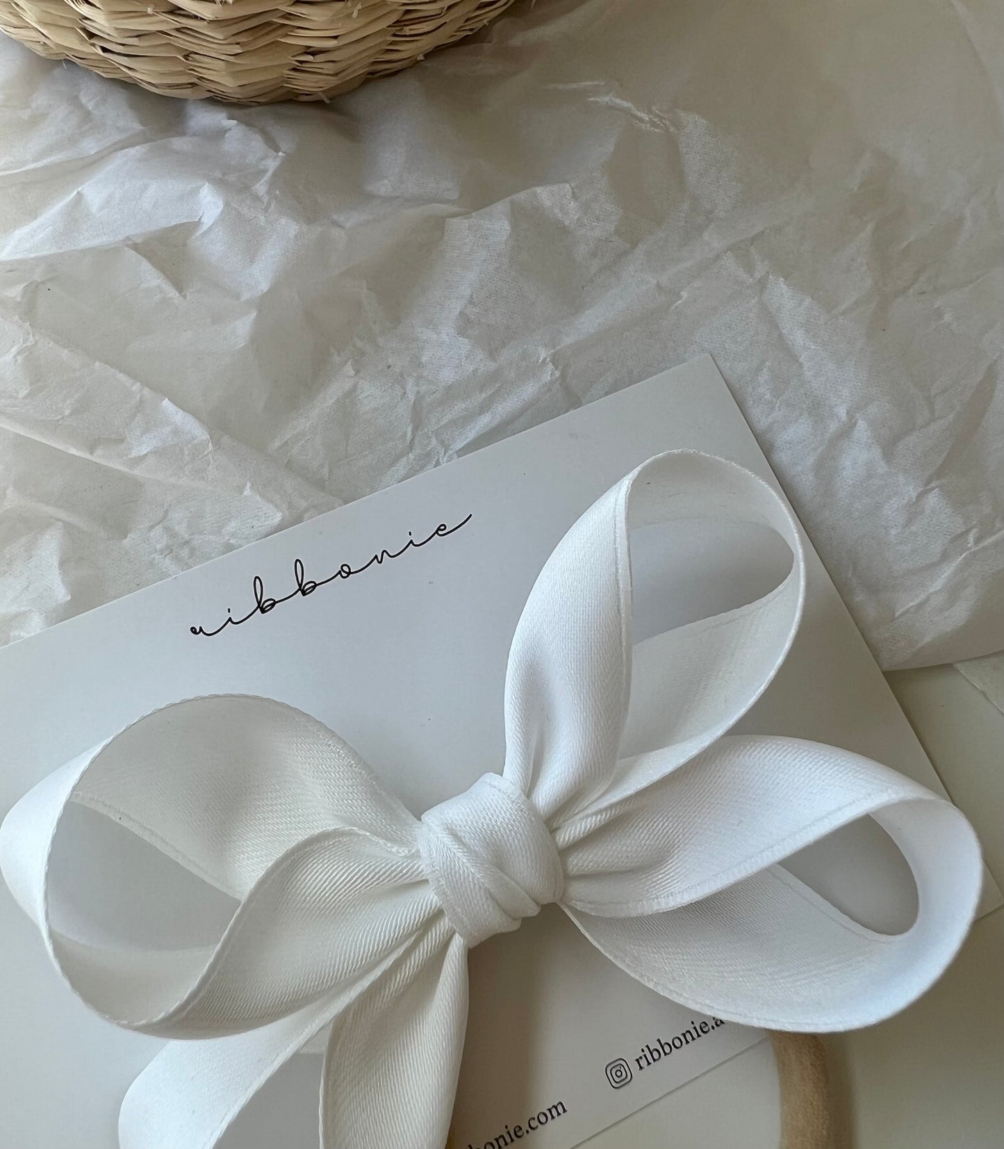 off white baby christening bow satin on stretchy nylon nude band