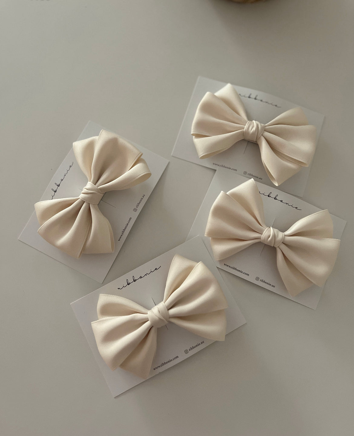 Ivory satin bow headband for newborns